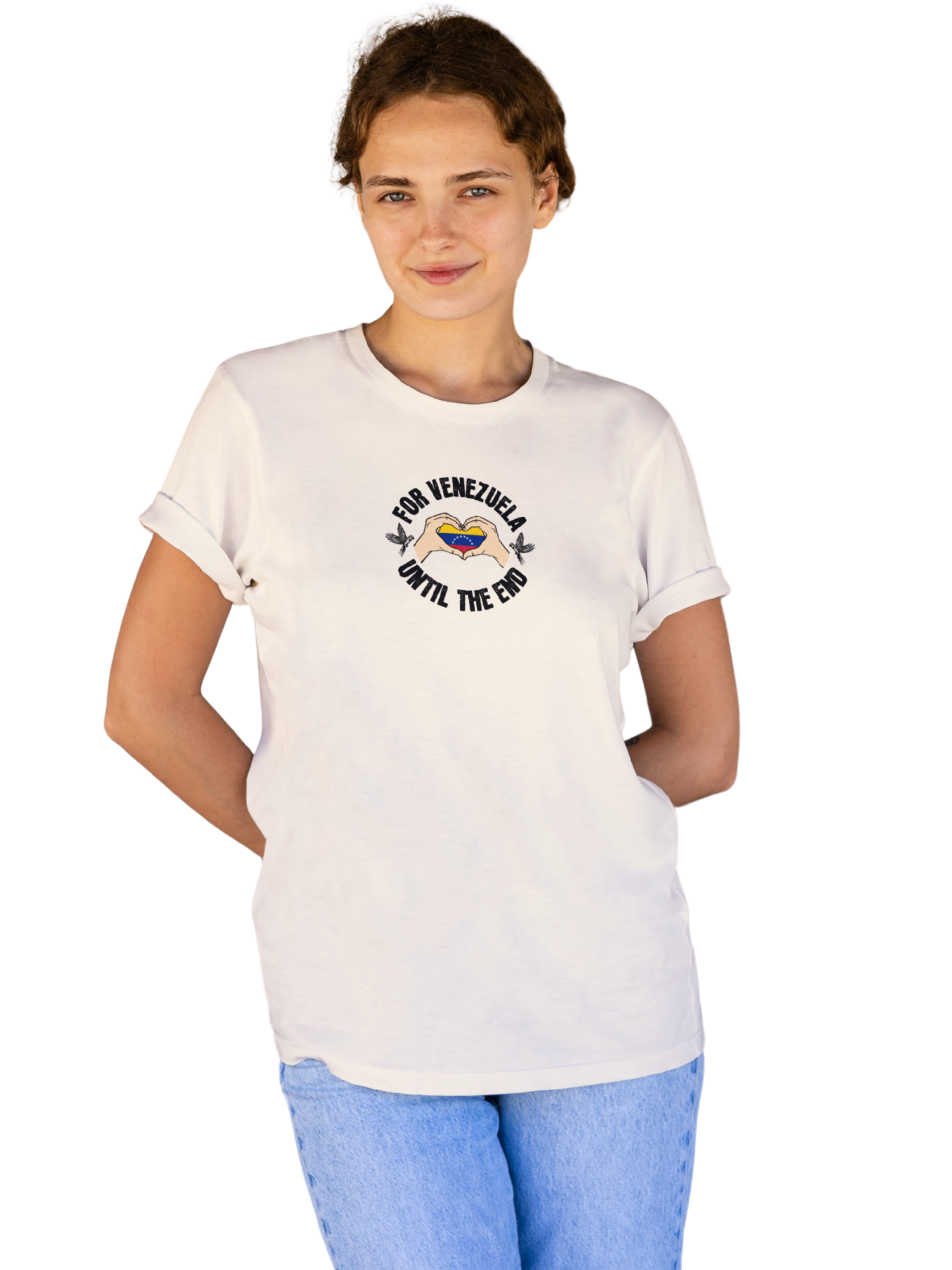 A young woman wears a pale orange T-shirt featuring the Venezuelan flag inside heart-shaped hands, the text "FOR VENEZUELA UNTIL THE END" around it, and one macaw on each side.