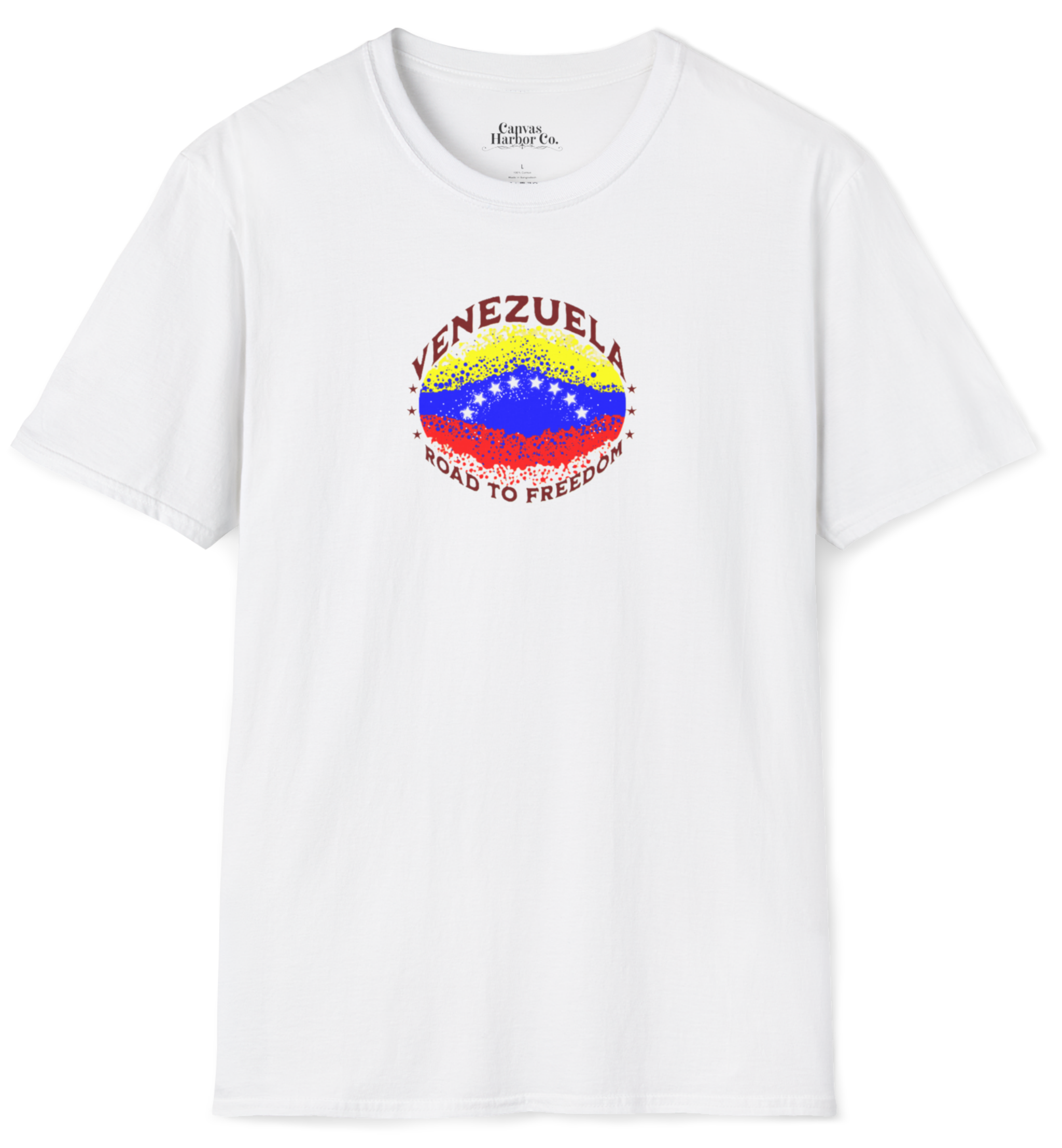 White T-shirt featuring an elliptical Venezuelan flag dotted with dots (like an explosion), with the word "VENEZUELA” at the top, the text “ROAD TO FREEDOM” below the flag, and 3 stars on each side. 