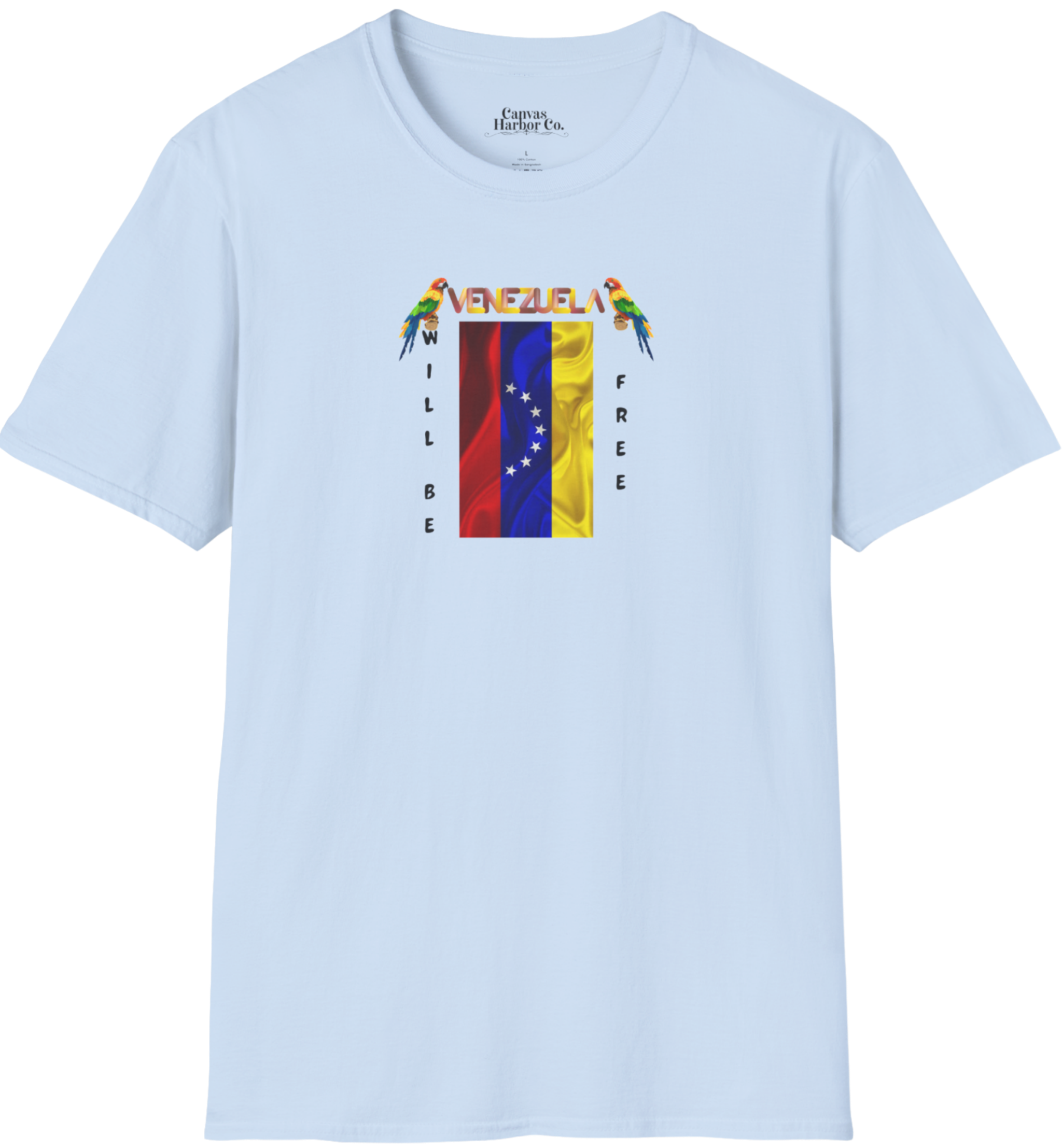 Light blue T-shirt featuring the 7-star Venezuelan flag, the name VENEZUELA at the top, and one macaw on each side. The words WILL BE and FREE are all placed vertically next to the flag.