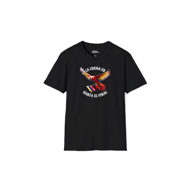 A black unisex t-shirt featuring a colorful macaw flying while holding the Venezuelan flag. The text "La Lucha Es" is at the top, and "Hasta El Final" is below the macaw.