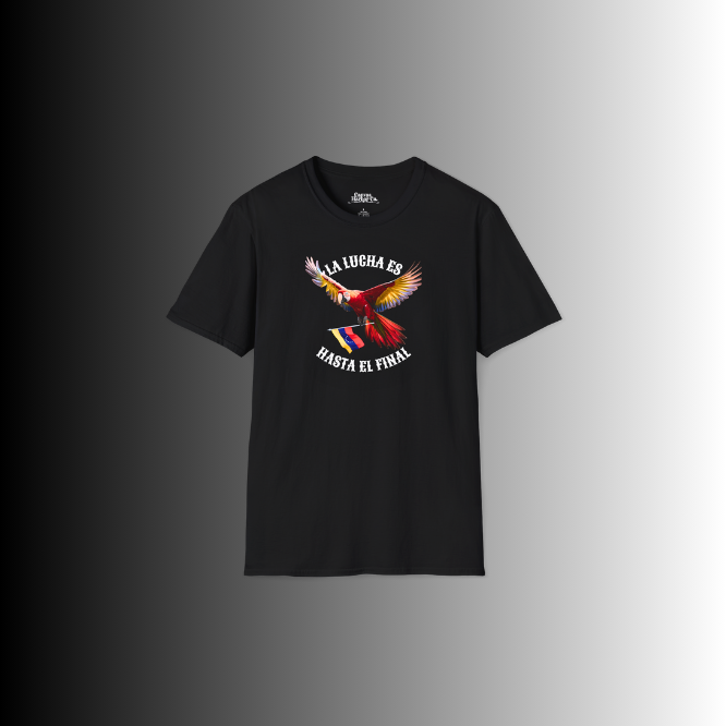 A black unisex t-shirt featuring a colorful macaw flying while holding the Venezuelan flag. The text "La Lucha Es" is at the top, and "Hasta El Final" is below the macaw.