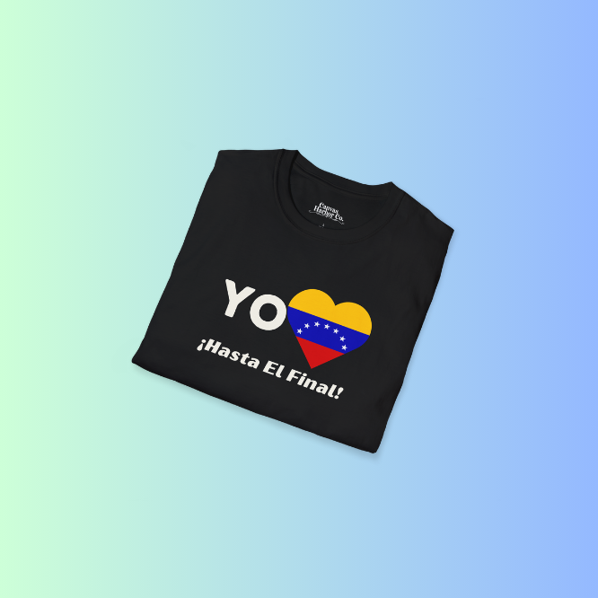 A folded black unisex t-shirt featuring a heart-shaped Venezuelan flag, the word "Yo" on the left, and the text "¡Hasta El Final!" reading below.
