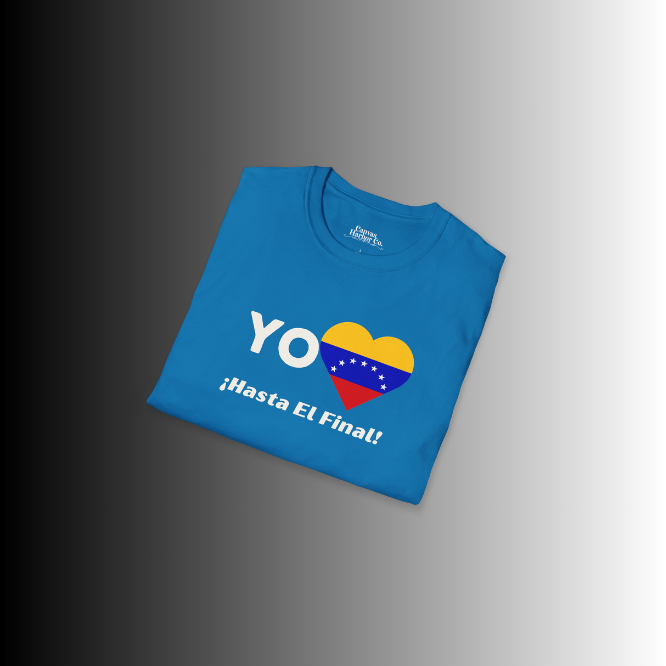 A folded blue unisex t-shirt featuring a heart-shaped Venezuelan flag, the word "Yo" on the left, and the text "¡Hasta El Final!" reading below.