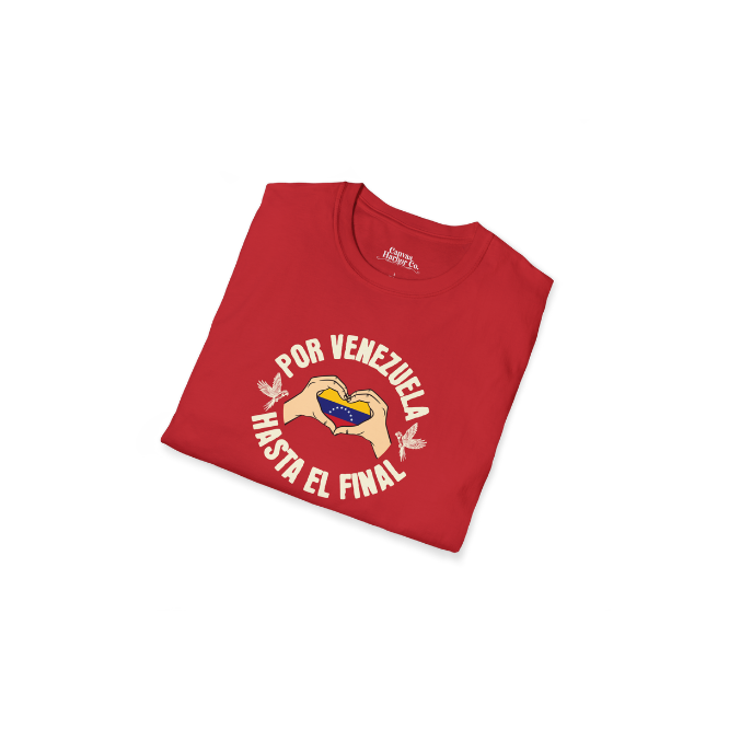A folded red unisex t-shirt featuring a Venezuelan flag inside heart-shaped hands, the text "Por Venezuela Hasta El Final", and a pair of macaws on either side.