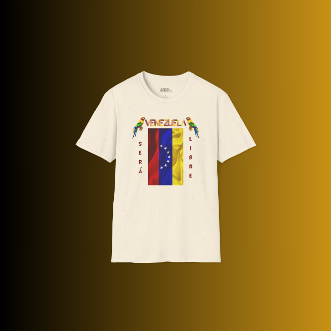 A white unisex t-shirt featuring a Venezuelan flag, the name "Venezuela" at the top, and a colorful macaw on either side. The words "Será" and "Libre" are vertically positioned beside the flag.