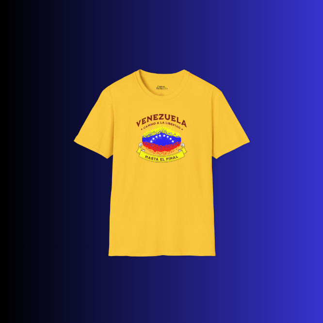 A yellow unisex t-shirt featuring a colorful, elliptically shaped Venezuelan flag dotted (like an explosion), with the text "Venezuela Camino a La Libertad" at the top and "Hasta El Final" on a yellow ribbon below the flag.